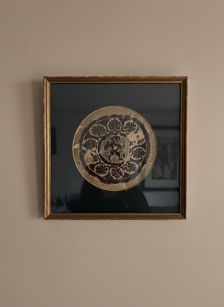 A framed coptic textile featuring a warrior