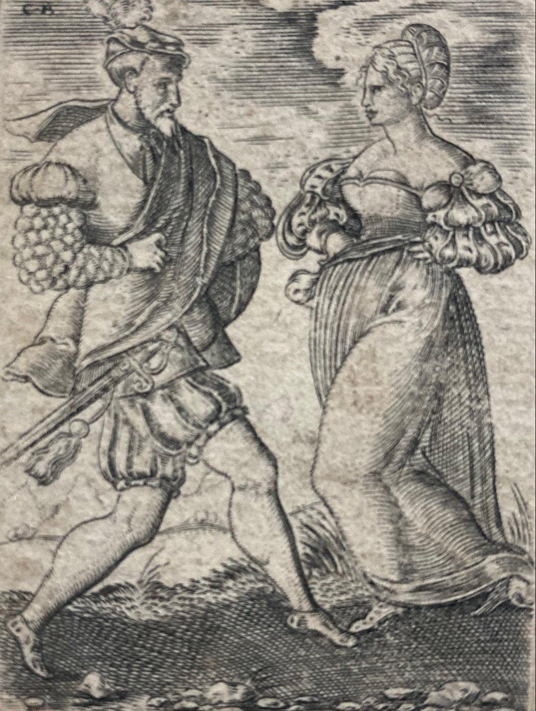 Black and white engraving of a man and woman dancing by Cornelius Bos