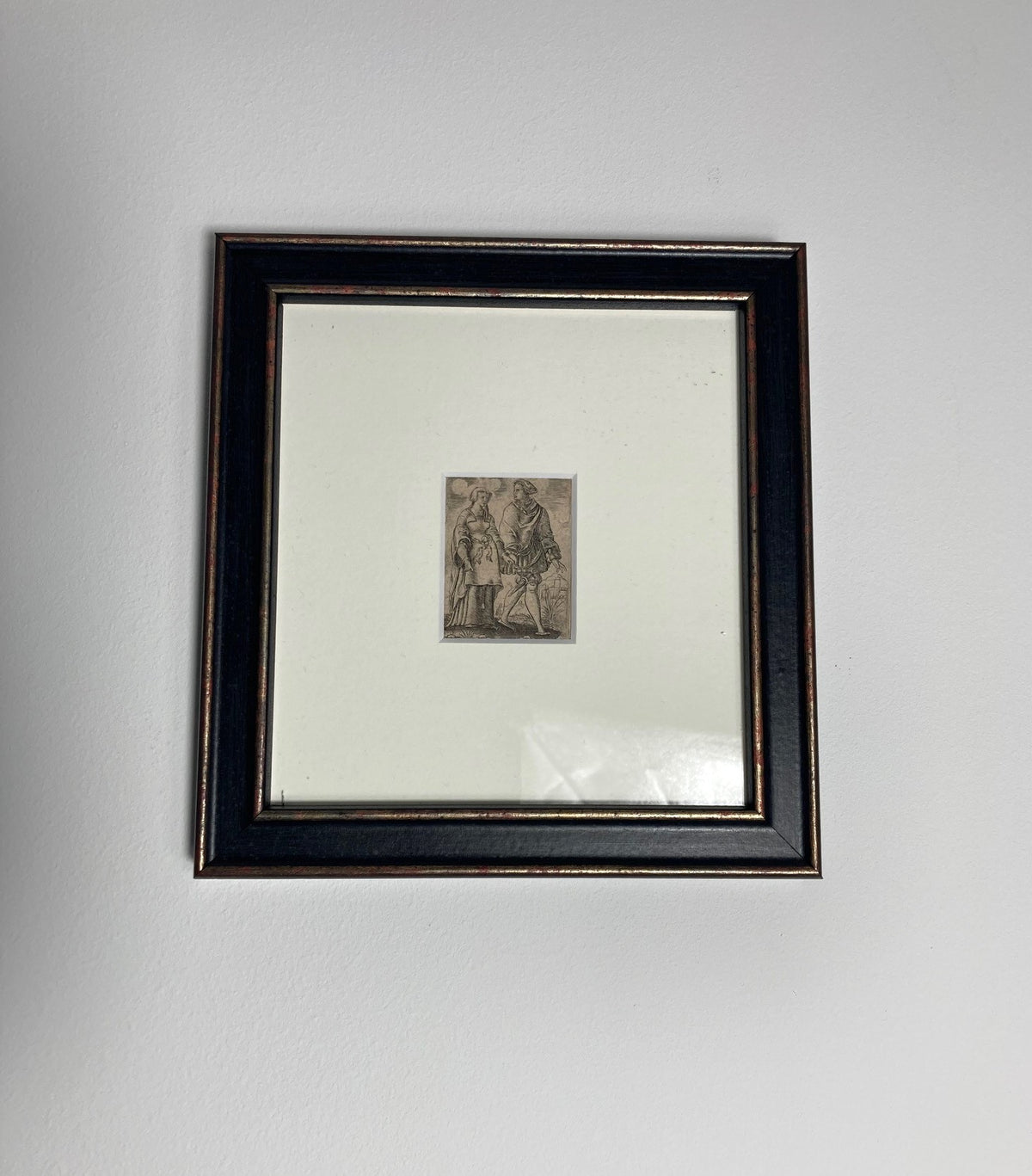 Framed artwork on a white wall