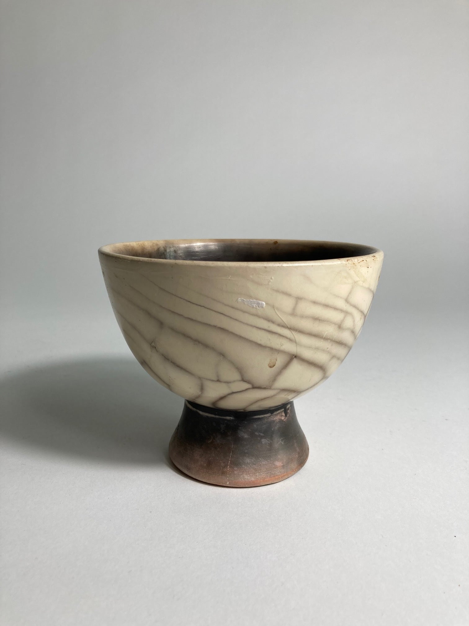 A small raku fired bowl by John Nuttgens