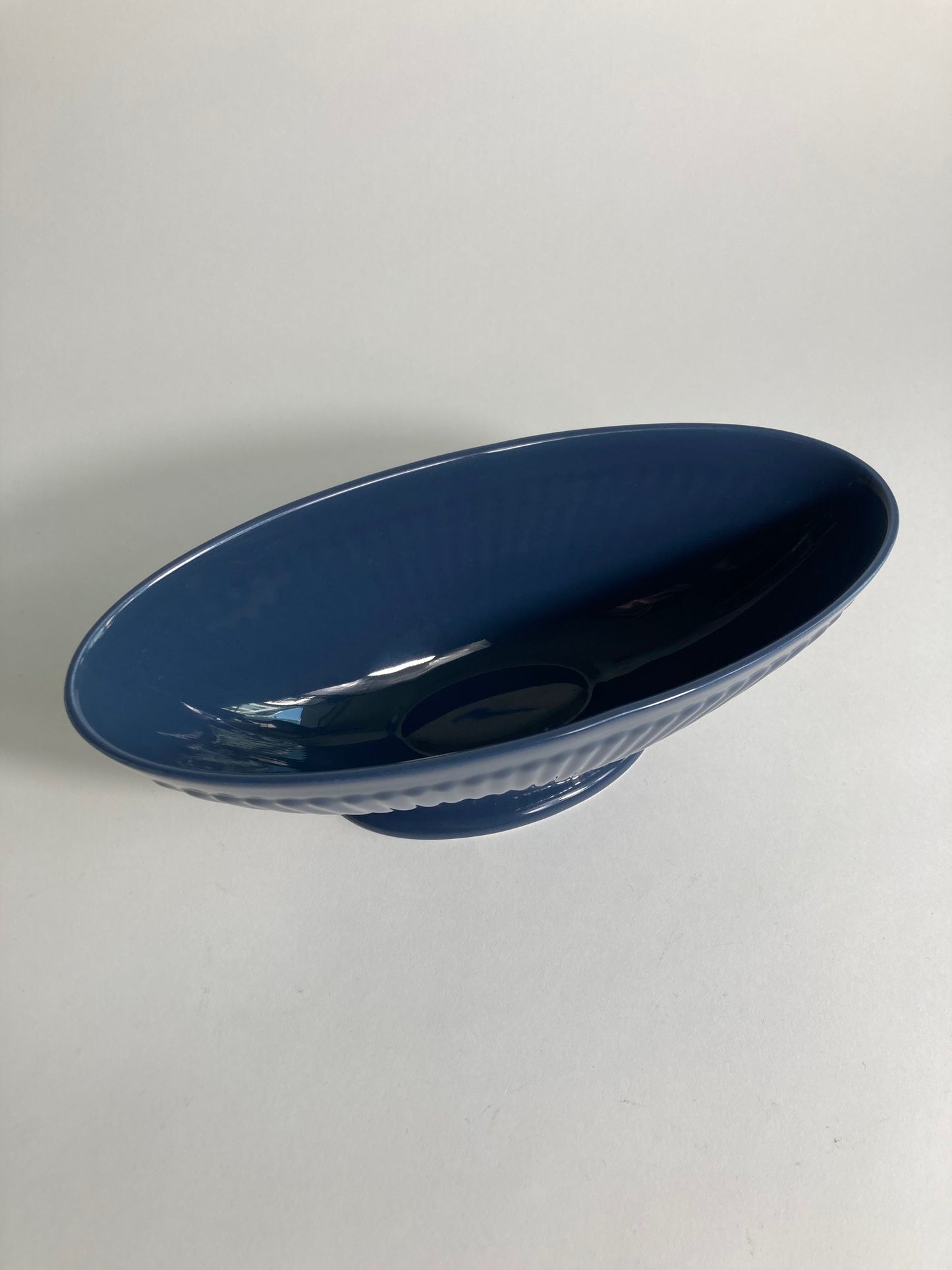 A navy planter produced by Wedgewood and designed by Keith Murray. Top view