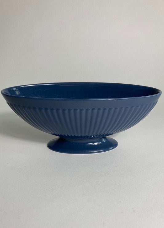 A navy planter produced by Wedgewood and designed by Keith Murray