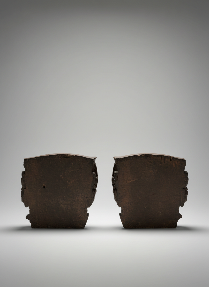 reverse picture of a pair of wood carvings